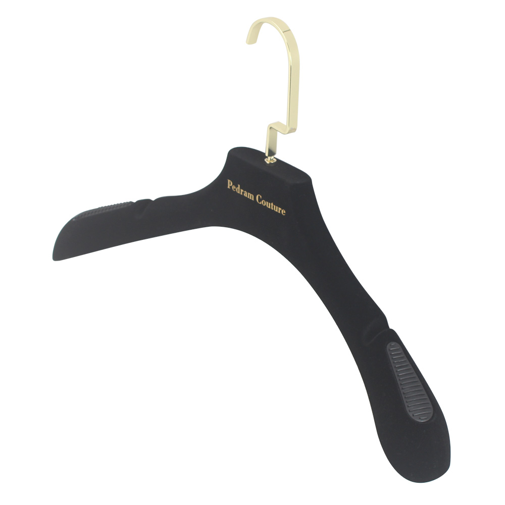 Close view of a wide black velvet hanger shoulder with grip detail