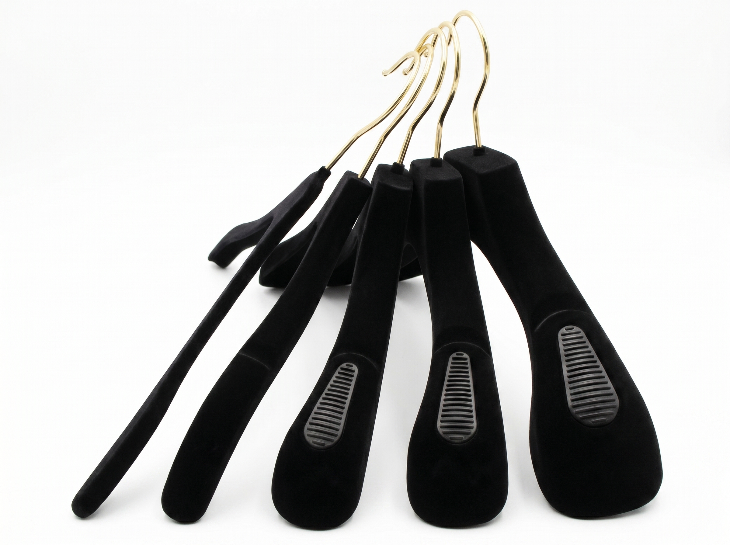 Different shoulder widths of black velvet hangers shown side by side